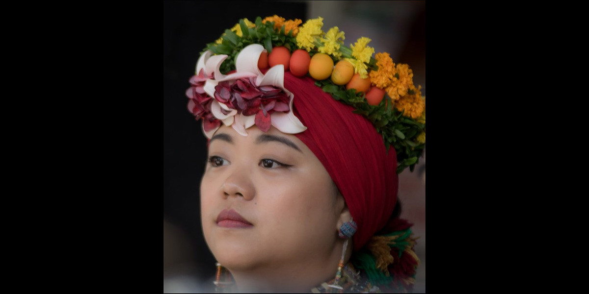12-woman-with-ornate-floral-headress-(cropped)